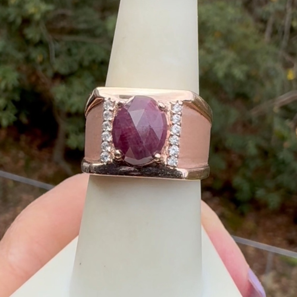 925 Rose Gold ring with an oval ruby cabochon and sapphire accents.